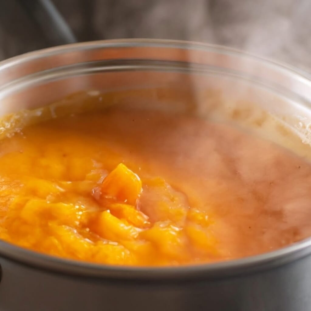 preparing slow cooker pumpkin soup 